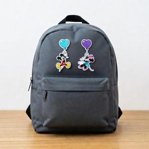 May include: A white ceramic mug with a black handle and the text "But First, Coffee" in a bold, black font. The mug is set against a blurred background, suggesting a cozy setting.