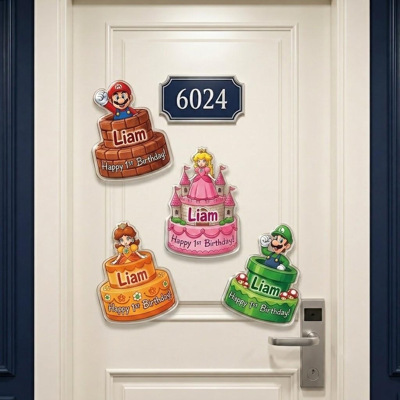 May include: Four decorative wall decals featuring Super Mario characters on birthday cakes with the name Liam and the text Happy 1st Birthday. The designs include Mario in a brick pipe, Princess Peach in a castle, Daisy on a cake, and Luigi in a green pipe.