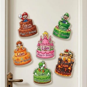 May include: Six decorative wall decals featuring Super Mario characters on tiered cakes. Each cake displays the name Liam and the text Happy 1st Birthday. Characters include Mario, Luigi, Princess Peach, Princess Daisy, Bowser, and Yoshi.