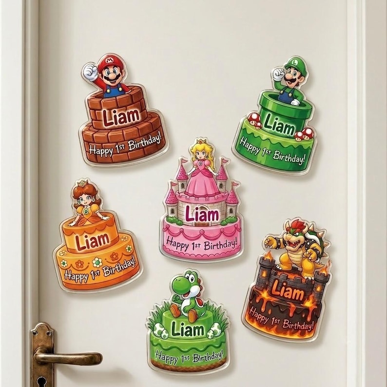 May include: Six decorative wall decals featuring Super Mario characters on tiered cakes. Each cake displays the name Liam and the text Happy 1st Birthday. Characters include Mario, Luigi, Princess Peach, Princess Daisy, Bowser, and Yoshi.