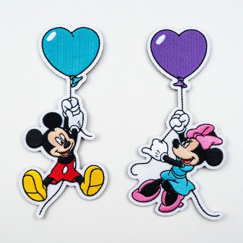 May include: A white ceramic mug with a black handle and the text "But First, Coffee" in a black, bold font. The mug is on a white surface.