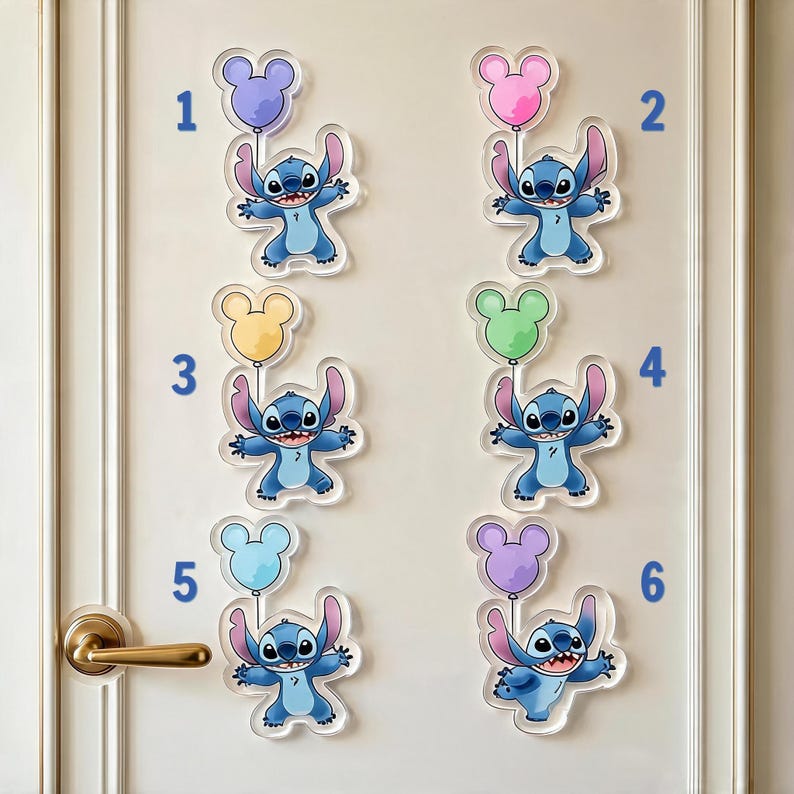 May include: Six acrylic wall decals featuring the blue character Stitch holding a different coloured balloon shaped like a mouse head. The balloons are purple, pink, yellow, green, light blue, and lavender. Each decal is numbered from one to six.