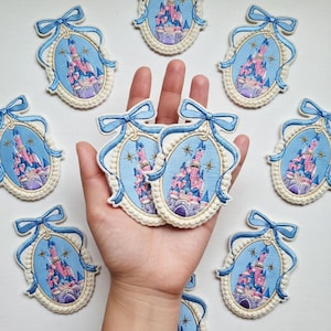 May include: A set of three ceramic mugs with a speckled, matte finish. The mugs are in shades of cream, light gray, and dark gray. Each mug has a simple, minimalist design and a rounded handle.