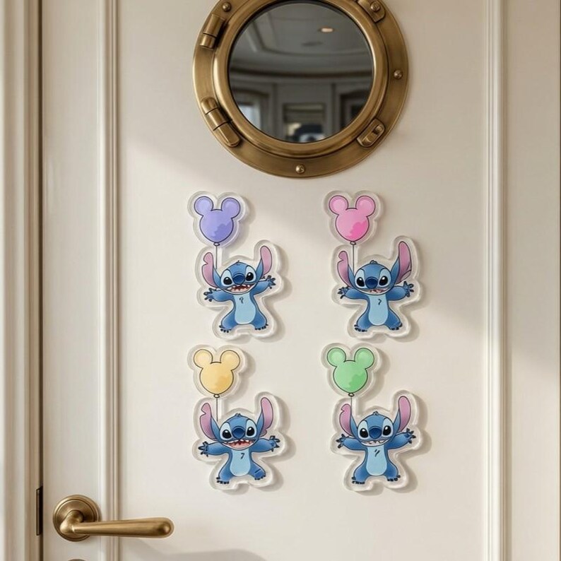 May include: Four clear acrylic wall decals featuring the blue character Stitch, each holding a different coloured Mickey Mouse-shaped balloon in purple, pink, yellow, and green. The decals are arranged on a white door with a brass porthole window.