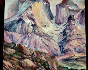 May include: Oil painting of a mountain range with snow-capped peaks and a rocky foreground. The artwork features a palette of pinks, purples, and yellows, with a cloudy sky. The painting captures a landscape scene.