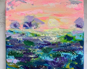 May include: Square canvas painting depicting a colorful landscape. The sky transitions from pink to yellow, with purple and gray brushstrokes suggesting clouds and mountains. The foreground features blues, greens, and purples, creating a textured, abstract scene.