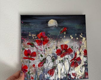 May include: A square canvas painting featuring vibrant red poppy flowers against a dark, moody background. The artwork incorporates textured gold leaf accents throughout the floral composition and a prominent, pale circular moon in the upper center.