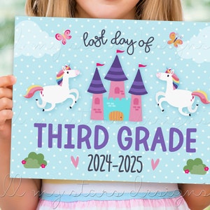 May include: A blue and white sign with white polka dots, featuring a pink castle with purple towers and two white unicorns with rainbow manes and tails. The sign reads "Last day of Third Grade 2024-2025".
