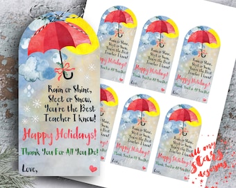 Op de afbeelding: Waterverf cadeaulabels met een rood paraplu-ontwerp, een gele zon en blauwe wolken. De labels bevatten de tekst: "Rain or Shine, Sleet or Snow, You're the Best Teacher I Know! Happy Holidays! Thank You For All You Do! Love,"