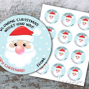 May include: A sheet of 10 round Christmas gift tags featuring a cartoon Santa Claus blowing a bubble. The tags are light blue with white stars and the text "Blowing Christmas Wishes Your Way! Merry Christmas! From:"