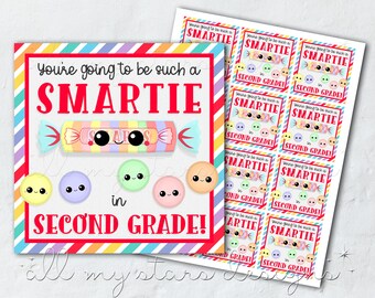 May include: A printable card with a rainbow striped border and the text "You're going to be such a SMARTIE in SECOND GRADE!" with a cartoon candy bar and candies with faces.