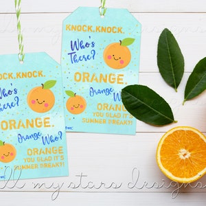 May include: Two blue and white gift tags with a knock knock joke about oranges. The text reads "Knock, Knock. Who's there? Orange. Orange who? Orange you glad it's summer break?!". The tags are decorated with orange slices and a blue and white polka dot pattern.