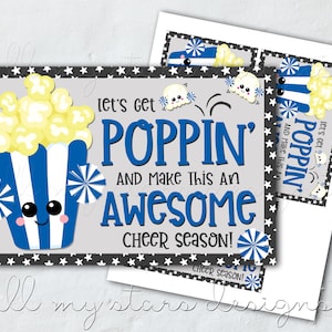 May include: A printable cheerleading sign with a cartoon popcorn bucket with a blue and white striped container and a happy face. The sign says "Let's get poppin' and make this an awesome cheer season!"