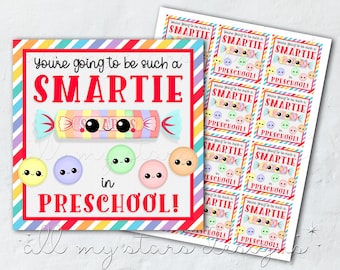 May include: Printable gift tags with a rainbow striped background and a cartoon Smarties candy bar. The text reads "You're going to be such a SMARTIE in PRESCHOOL!"