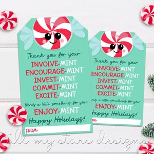 May include: Two turquoise and white gift tags with a red and white candy cane design. The tags have the text "Thank you for your INVOLVE-MINT ENCOURAGE-MINT INVEST-MINT COMMIT-MINT EXCITE-MINT Here's a little something for your ENJOY-MINT Happy Holidays!" and "Thank you for your INVOLVE-MINT ENCOURAGE-MINT INVEST-MINT COMMIT-MINT EXCITE-MINT Here's a little something for your ENJOY-MINT Happy Holidays!"