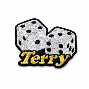 Könnte beinhalten: Gestickter Aufnäher mit zwei weißen Würfeln mit schwarzen Punkten, umrandet von Schwarz. Das Wort "Terry" ist darunter in Gold gestickt. Geeignet für Kleidung oder Accessoires.