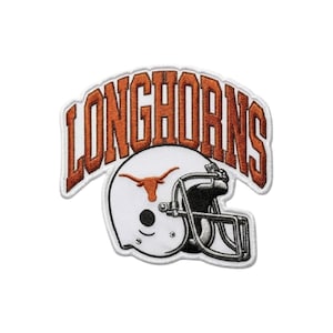 May include: Embroidered patch featuring a white football helmet with a burnt orange longhorn logo. The word "LONGHORNS" arches above the helmet in burnt orange lettering with a white border. The patch has a white background and a stitched edge.
