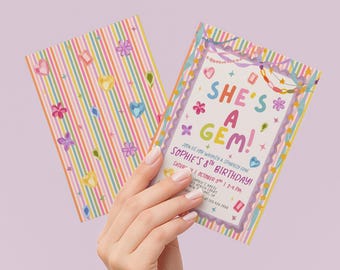 May include: Two rectangular birthday invitation cards featuring a colorful striped pattern with illustrations of flowers, stars, and gems. The text reads: SHE'S A GEM! JOIN US FOR WHIMSY & SPARKLY FUN! SOPHIE'S 8TH BIRTHDAY! SATURDAY, OCTOBER 5TH | 2-4 PM.