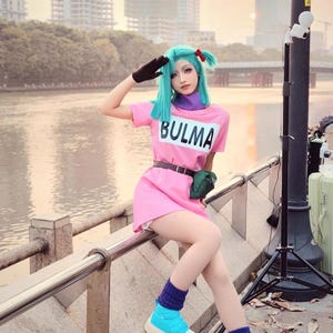 sexy bulma tight dress Saiyan Ru | Night wind catching the fabric of Bulma's red dress. City lights glowing beneath her as she stands at the edge. Vegeta steps behind her, Slim Fabric Bulma