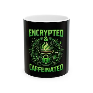 May include: A white ceramic mug with a black handle and the text "But First, Coffee" in a handwritten style. The mug is on a white surface. The mug is approximately 10 cm tall.