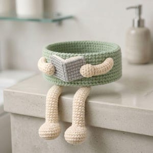 Crochet toilet decor project featuring toilet paper buddy amigurumi