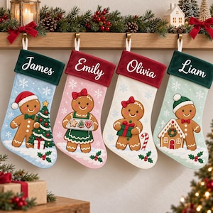 May include: Four personalized Christmas stockings featuring gingerbread characters. The stockings have velvet cuffs with the names James, Emily, Olivia, and Liam embroidered in white. Each stocking displays a unique gingerbread figure with festive holiday motifs like a Christmas tree, cookies, a gift, and a gingerbread house.