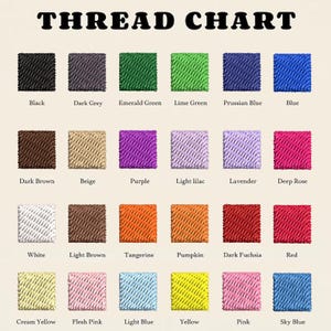 May include: A thread chart featuring twenty-four square swatches of embroidery thread arranged in four rows. Each swatch is labelled with its corresponding colour name, including black, dark grey, emerald green, lime green, blue, brown, and pink.