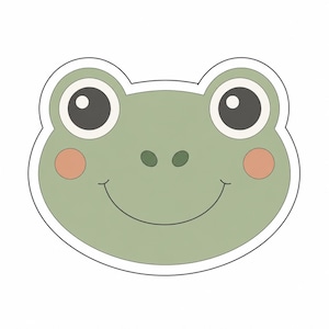 Peut inclure: Un autocollant découpé représentant un visage de grenouille de dessin animé avec une peau vert sauge, de grands yeux noirs avec des reflets blancs, deux petites narines vert foncé, un fin sourire noir courbé et des joues rose pêche.