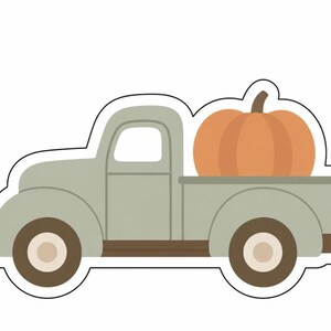May include: A die-cut sticker featuring a vintage-style pickup truck in a muted sage green color. The truck bed carries a large, round, orange pumpkin with a brown stem. The wheels are dark brown with light beige centers, and the entire design has a white border.
