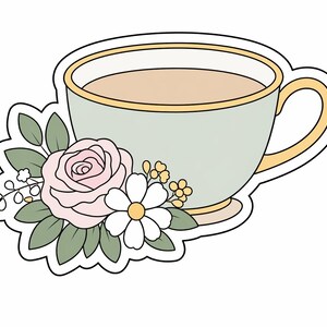 May include: A pale green teacup with a gold rim and handle, filled with a beige liquid. A pink rose, white daisy, and green leaves decorate the cup's side. The design is outlined in black.