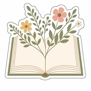 以下が含まれることがあります： 開いた本と花のイラストのステッカー。本のページはベージュで、表紙はオリーブグリーンです。桃色、黄色、白の花が本から咲き、緑の葉と茎があります。