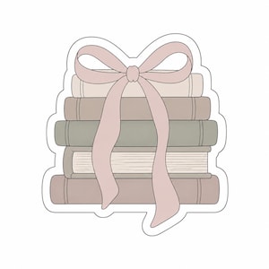 May include: A stack of five books in muted tones of cream, taupe, sage green, and dusty rose, tied together with a large, decorative dusty rose ribbon that drapes over the front. The illustration features clean lines and a die-cut sticker shape.