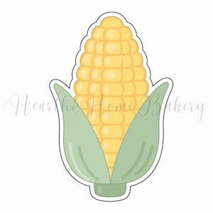 May include: A corn-shaped cookie cutter featuring a yellow corn cob and green husks. The cutter has a white outline and the text "Hearth & Home Bakery" in a cursive font.