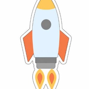 May include: A cartoon-style rocket ship sticker with a white outline. The rocket has a light blue body, orange fins, a yellow top, and gray accents. Two orange and yellow flames emanate from the bottom.
