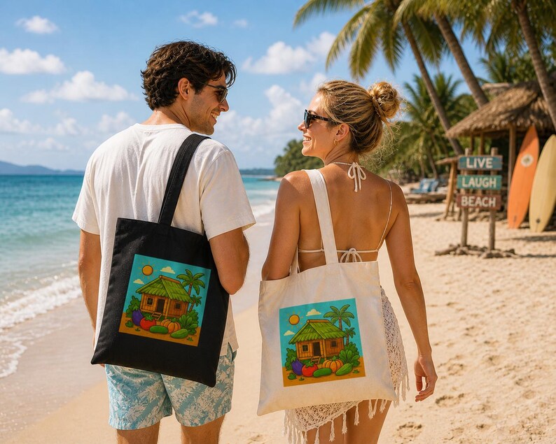 May include: Two tote bags, one black and one off-white, each featuring a vibrant illustration of a tropical hut, vegetables, and palm trees. The bags are carried by people on a sandy beach. A sign in the background reads "Live Laugh Beach".