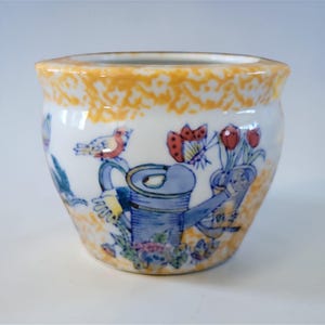 May include: A set of three ceramic mugs with a speckled, matte finish. The mugs are in shades of cream, light gray, and dark gray. Each mug has a simple, minimalist design, perfect for coffee or tea.
