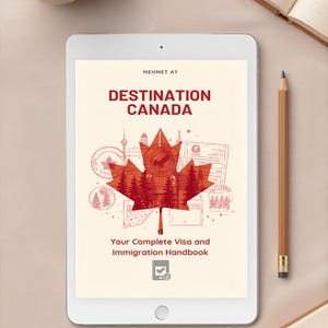 May include: A digital tablet displays the cover of a handbook titled "Destination Canada" with a red maple leaf design. The text "Your Complete Visa and Immigration Handbook" is below the title. A cup of coffee, a pencil, and a notebook are also on the table.