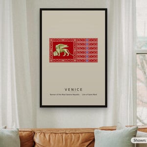 May include: A framed wall art print featuring the flag of Venice with a gold winged Lion of Saint Mark on a red background. Below the flag, the text reads VENICE, Banner of the Most Serene Republic, Lion of Saint Mark. The print is 24 by 36 inches.