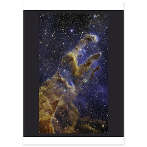 May include: A high-resolution space photograph of the Pillars of Creation, featuring towering, dense clouds of interstellar gas and dust in shades of gold and brown, set against a deep blue and black backdrop filled with numerous bright white stars.