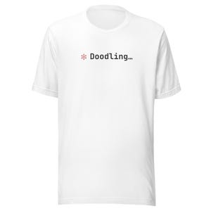 Könnte beinhalten: Ein Set aus drei Keramikbechern mit gesprenkelter, matter Oberfläche. Die Becher sind in Creme-, Hellgrau- und Dunkelgrautönen gehalten. Jeder Becher hat ein schlichtes, minimalistisches Design, ideal für Kaffee oder Tee.