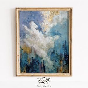 May include: Abstract art print in a gold frame. The artwork features a cloudy sky with shades of blue, white, and gold. The bottom of the painting has dark teal and purple brushstrokes. The print is from Vintage Vine Prints.