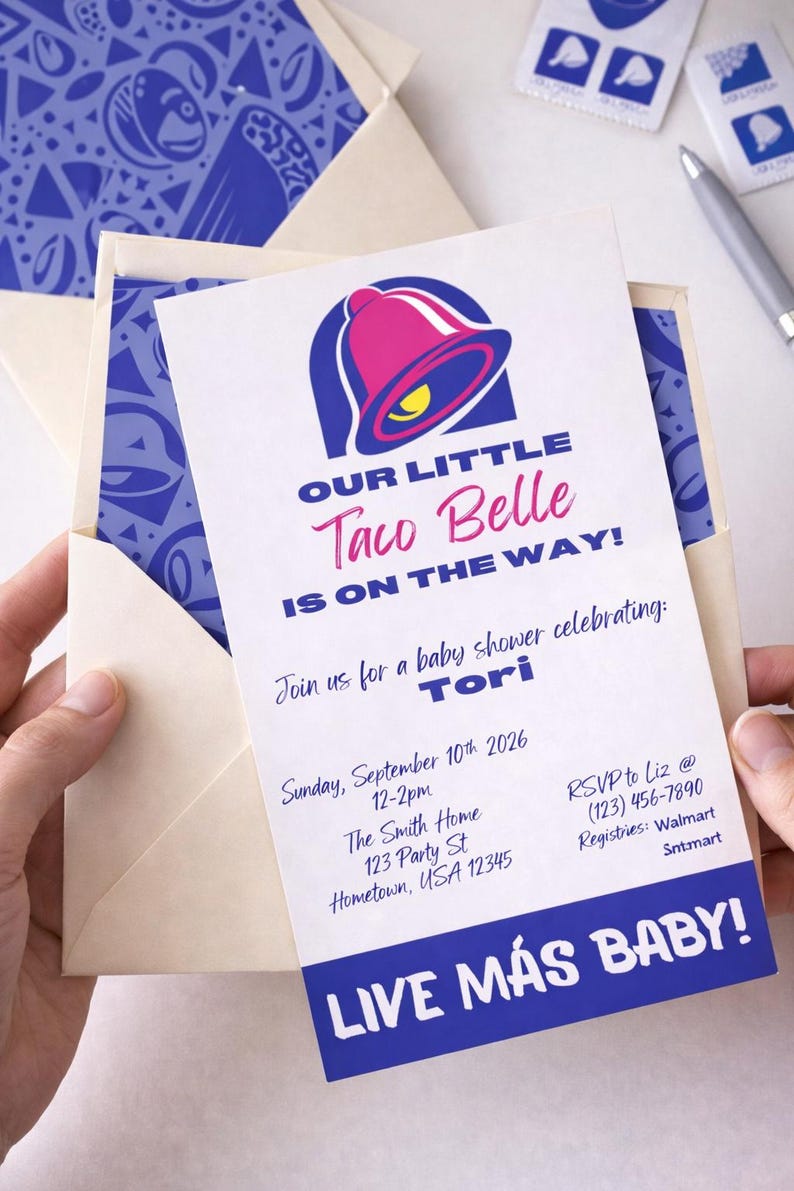 May include: A baby shower invitation featuring the Taco Bell logo with the text "OUR LITTLE Taco Belle IS ON THE WAY!" The invitation is in a cream envelope with a blue patterned liner. The invitation includes the date, time, location, and RSVP information.