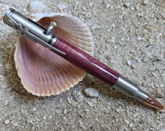 Handmade Purpleheart bolt-action pen with Antique Pewter trim—smooth action, gift-ready.