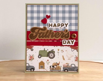 May include: A handmade Father's Day card with a blue and white gingham pattern and a red stripe. The card features the words "Happy Father's Day" and a farm scene with a tractor and animals.
