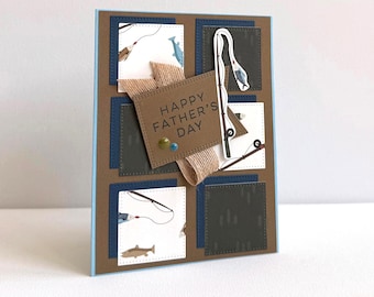 May include: A Father's Day card with a fishing theme. The card has a brown background with navy blue and white squares. The card features a fishing rod, fish, and the text "HAPPY FATHER'S DAY".