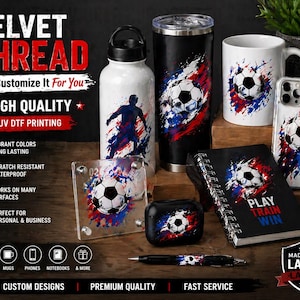 May include: A collection of custom designed items featuring a soccer ball design with red, white, and blue accents. Items include a water bottle, tumbler, mug, phone case, notebook, and pen. The text on the notebook reads "Play Train Win".