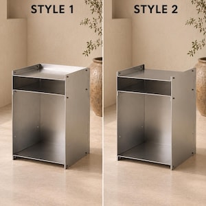 May include: A silver-colored metal side table with an open design, featuring a flat top surface, a middle shelf, and a large open storage compartment at the bottom. The image displays two variations labeled as STYLE 1 and STYLE 2.