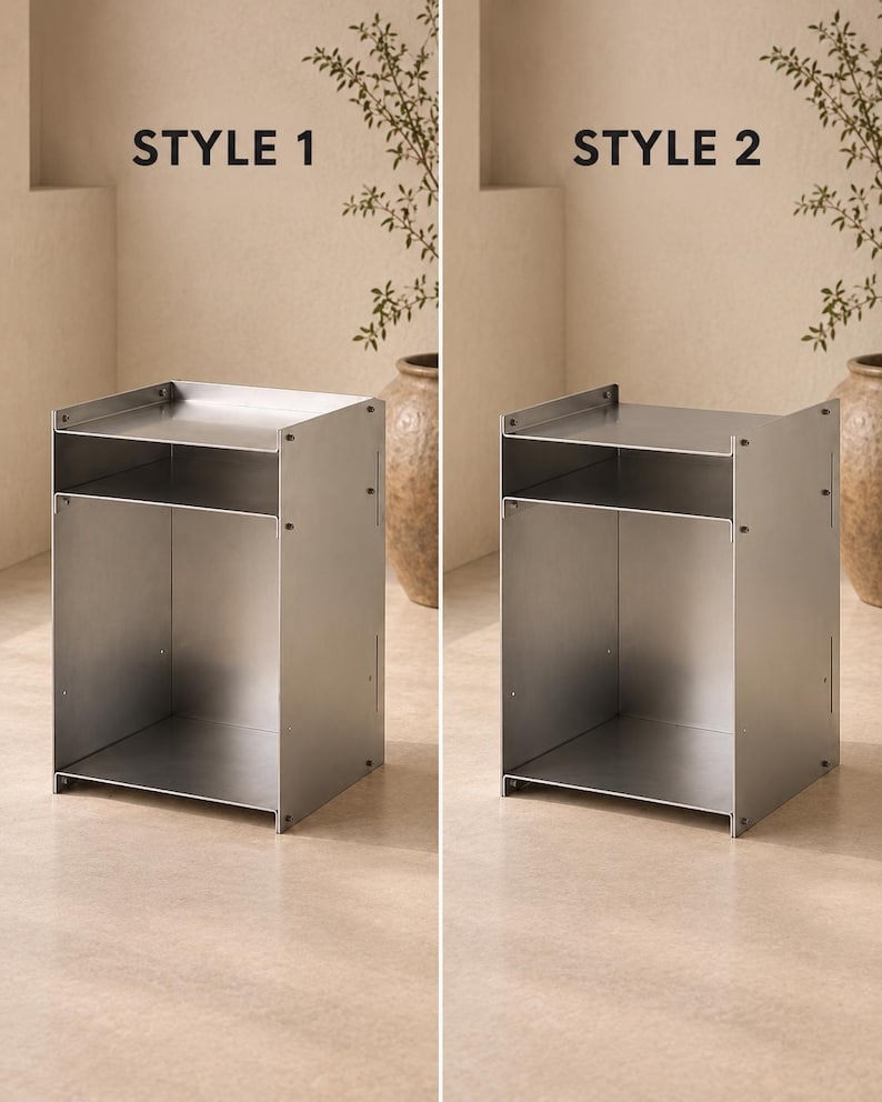 May include: A silver-colored metal side table with an open design, featuring a flat top surface, a middle shelf, and a large open storage compartment at the bottom. The image displays two variations labeled as STYLE 1 and STYLE 2.