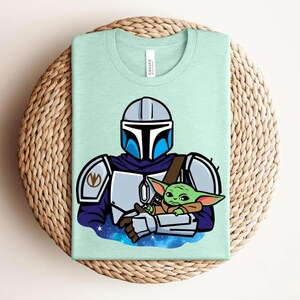 May include: A set of three ceramic mugs with a speckled, matte finish. The mugs are in shades of cream, light gray, and dark gray. Each mug has a simple, minimalist design and a rounded handle.