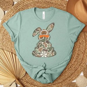 May include: A rustic wooden sign with the text "Welcome to our home" in white lettering. The sign features a distressed finish and a simple, inviting design, perfect for front door decor.